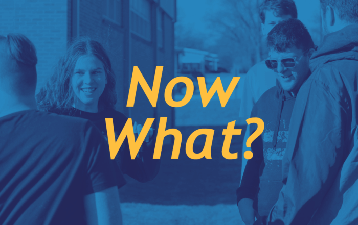 Young adults standing outside in a group with text that reads "now what?"